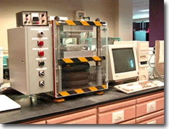 Computer controlled handsheet press with heated platens for wet-pressing studies